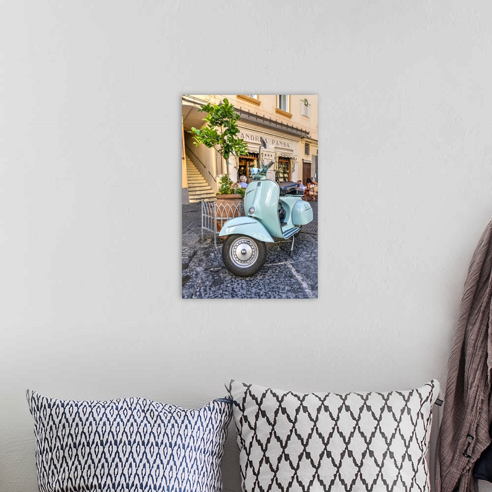 A bohemian room featuring Vespa scooter parked in Amalfi, Campania, Italy