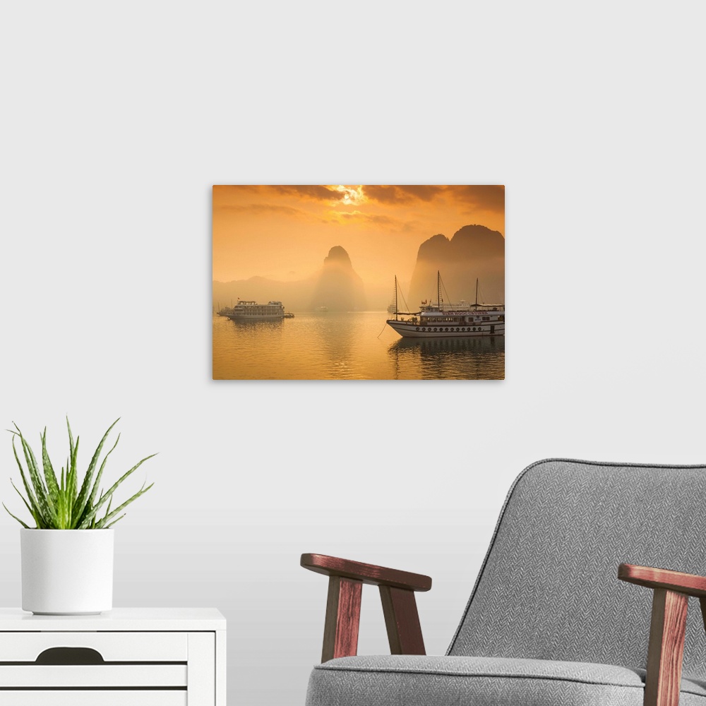 A modern room featuring Vietnam, Halong Bay, tourist boats, sunrise.