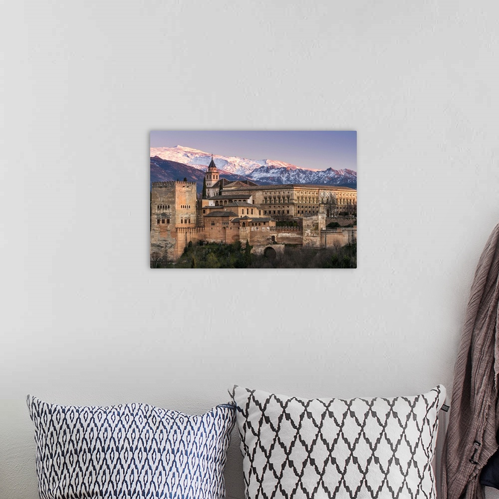 A bohemian room featuring View at sunset of Alhambra palace with the snowy Sierra Nevada in the background, Granada, Andalu...