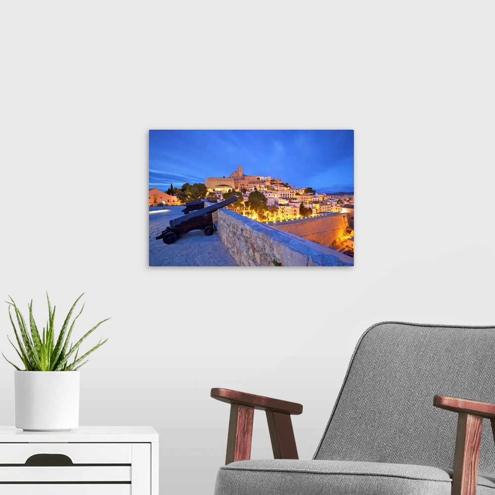A modern room featuring View from Baluarte de Santa Llucia to D'Alt Vila, Ibiza, Balearic Islands, Spain.