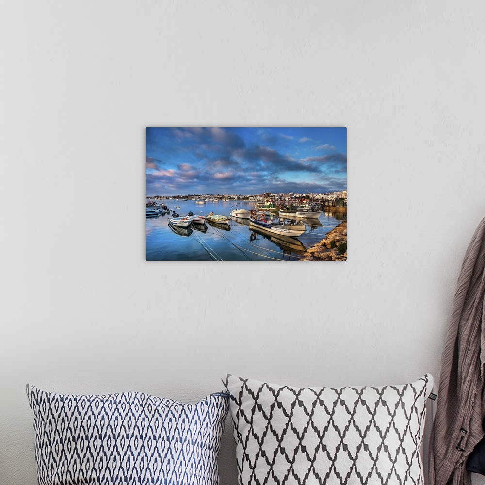 A bohemian room featuring View from fishing harbour towards old town, Lagos, Algarve, Portugal