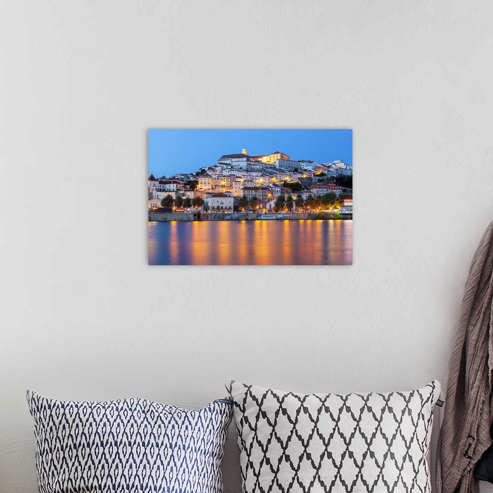 A bohemian room featuring View of Coimbra ol town and Mondego River at dusk. Coimbra, Coimbra district, Centro Region, Port...