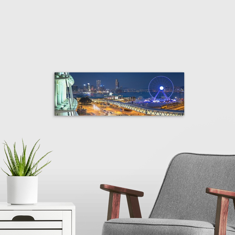 A modern room featuring View of Star Ferry pier, observation wheel and Tsim Sha Tsui skyline, Hong Kong, China