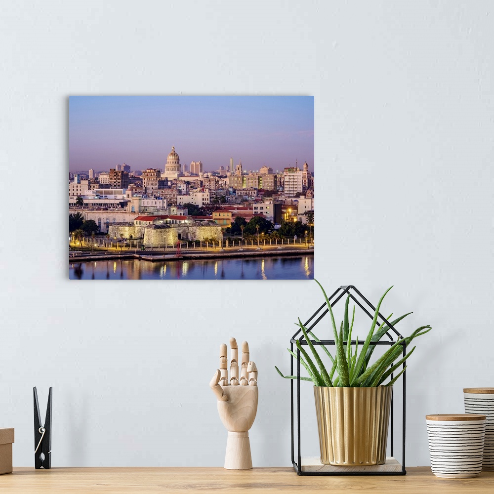 A bohemian room featuring View over Castle of the Royal Force and Habana Vieja towards El Capitolio at dawn, Havana, La Hab...