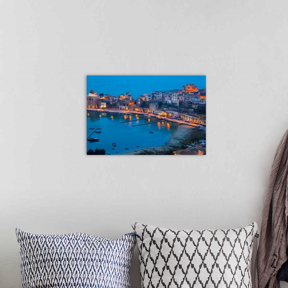 A bohemian room featuring View over harbour at dusk, Castellammare del Golfo, Sicily, Italy