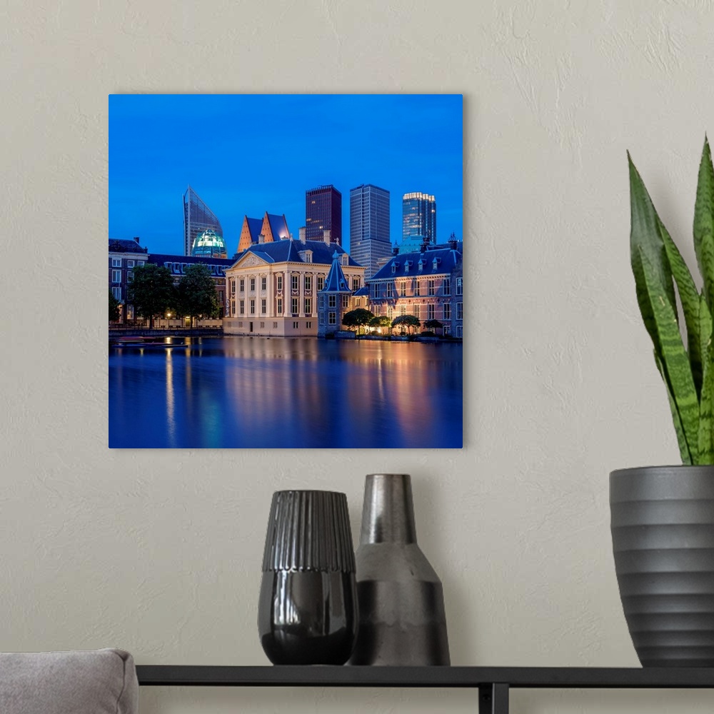 A modern room featuring View Over Hofvijver Towards Mauritshuis Art Museum And City Center, Twilight, The Hague, South Ho...