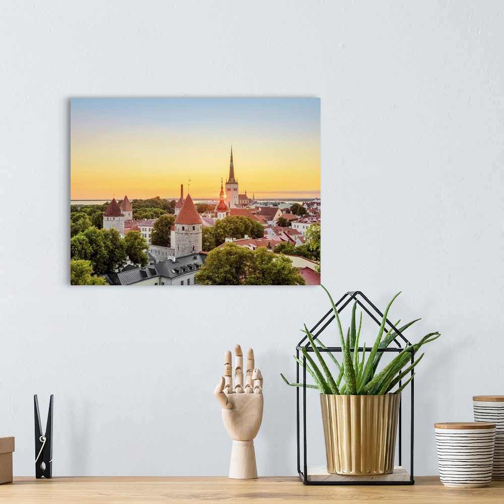 A bohemian room featuring View over the Old Town towards St. Olaf's Church at sunrise, Tallinn, Estonia