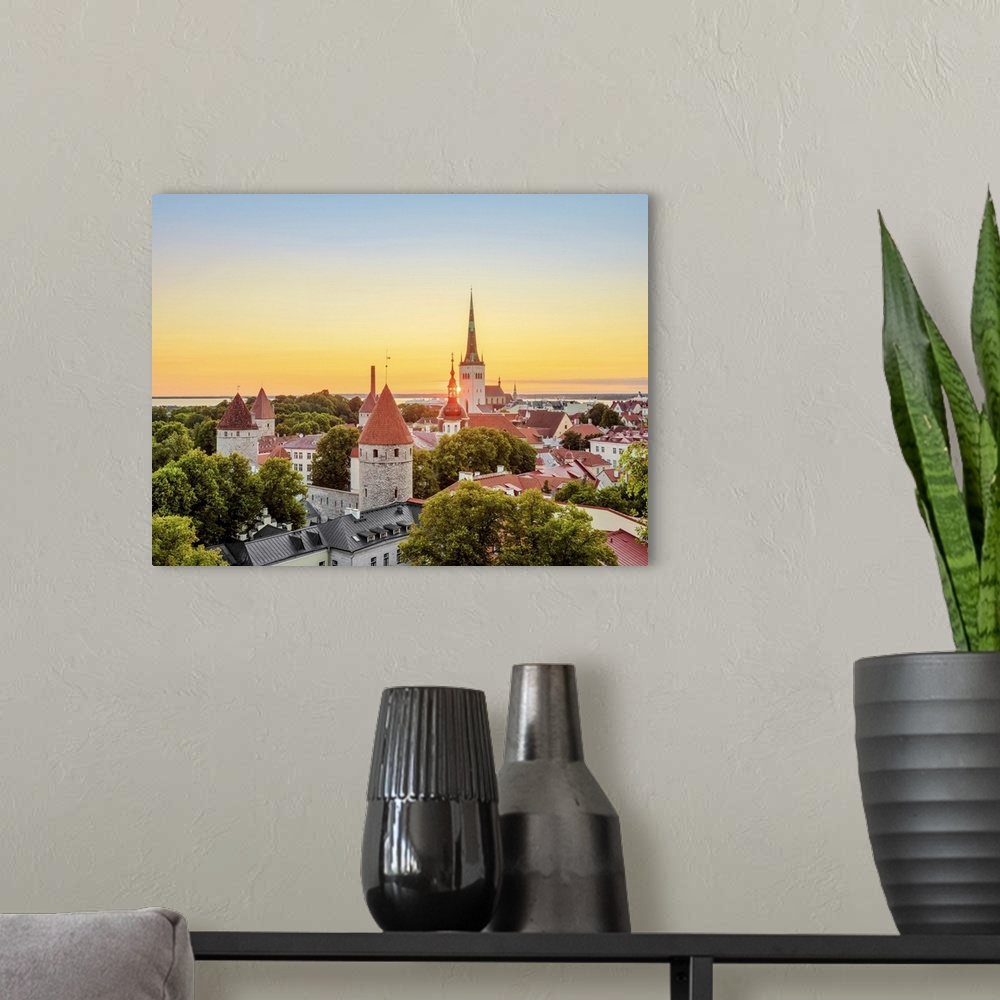 A modern room featuring View over the Old Town towards St. Olaf's Church at sunrise, Tallinn, Estonia