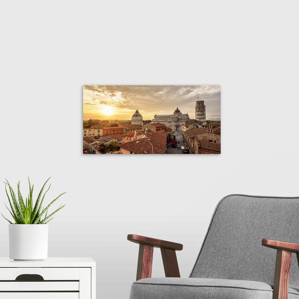 A modern room featuring View over Via Santa Maria towards Cathedral and Leaning Tower at sunset, Pisa, Tuscany, Italy.