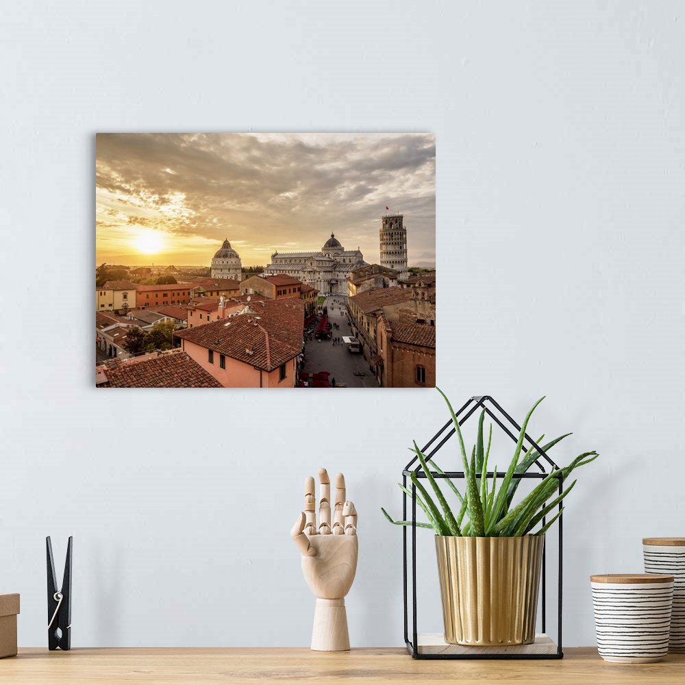 A bohemian room featuring View over Via Santa Maria towards Cathedral and Leaning Tower at sunset, Pisa, Tuscany, Italy.