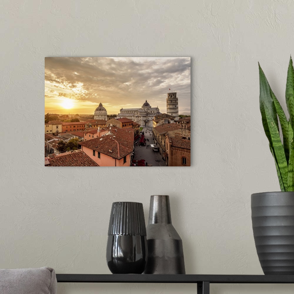 A modern room featuring View over Via Santa Maria towards Cathedral and Leaning Tower at sunset, Pisa, Tuscany, Italy.
