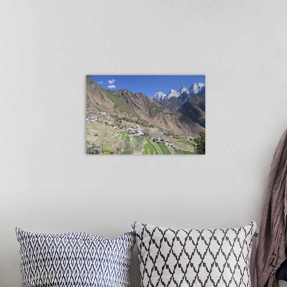 A bohemian room featuring Village in Tiger Leaping Gorge and Jade Dragon Snow Mountain (Yulong Xueshan), Yunnan, China.