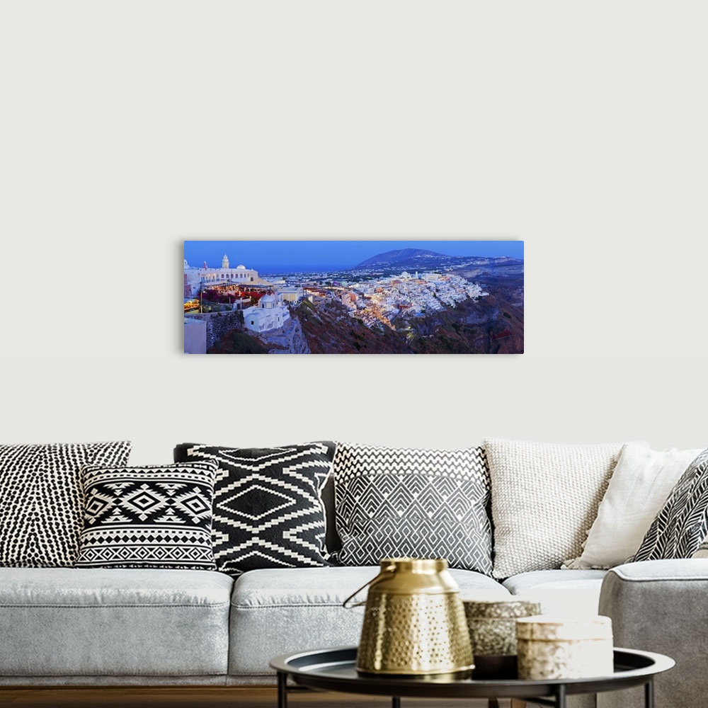 A bohemian room featuring Elevated view over the Volcanic landscape and main town of Fira, Santorini (Thira), Cyclades Isla...