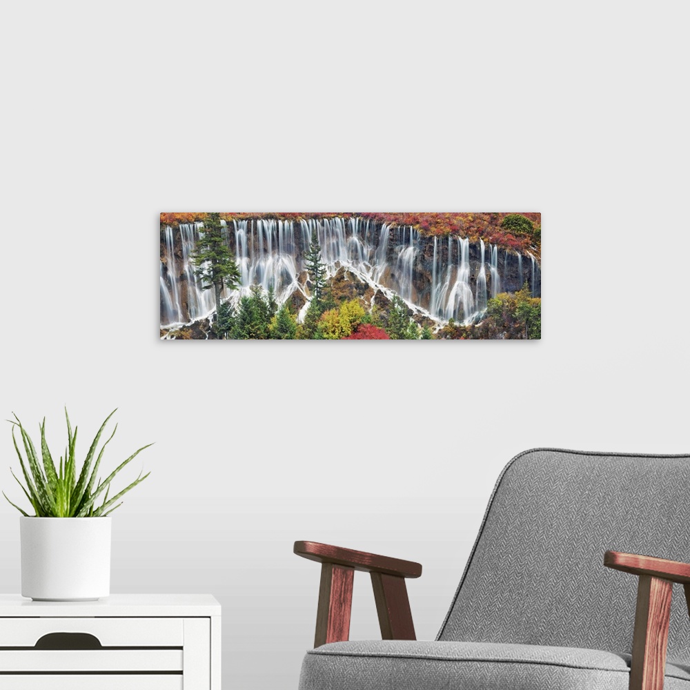 A modern room featuring Waterfall Nuorilang and forest in autumn. China, Sichuan, Jiuzhaigou, Nuorilang Waterfall. Sichua...