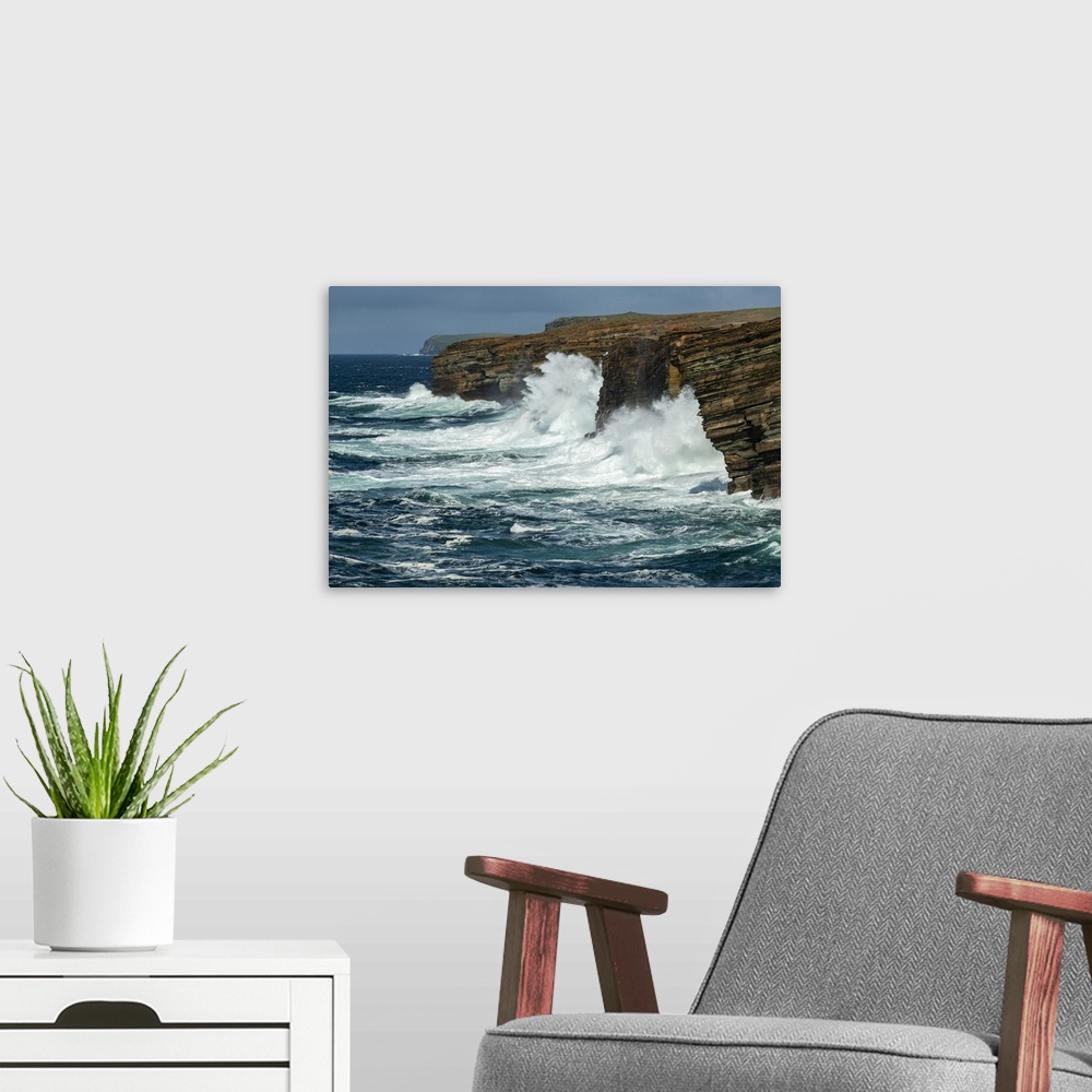 A modern room featuring Huge waves crash against the layered cliffs of Yesnaby on the wild west coast of Mainland, Orkney...