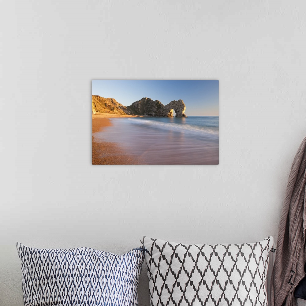 A bohemian room featuring Waves sweeping onto the deserted beach at Durdle Door, Dorset, England. Winter