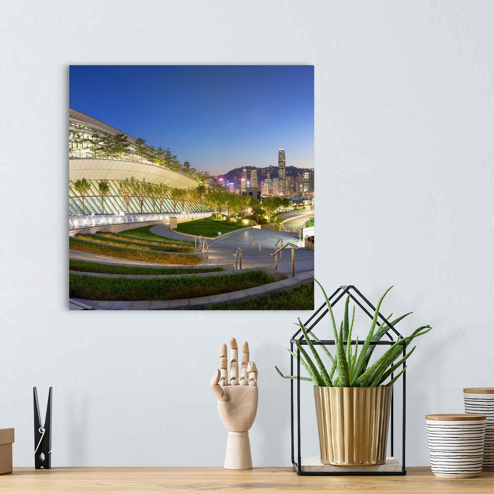 A bohemian room featuring West Kowloon High Speed Rail Station and skyline at dusk, Kowloon, Hong Kong.