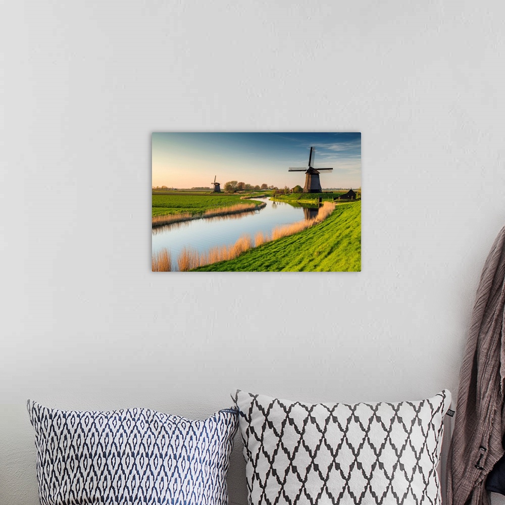 A bohemian room featuring Windmill Along Canal, near Schermerhorn, North Holland, Netherlands.