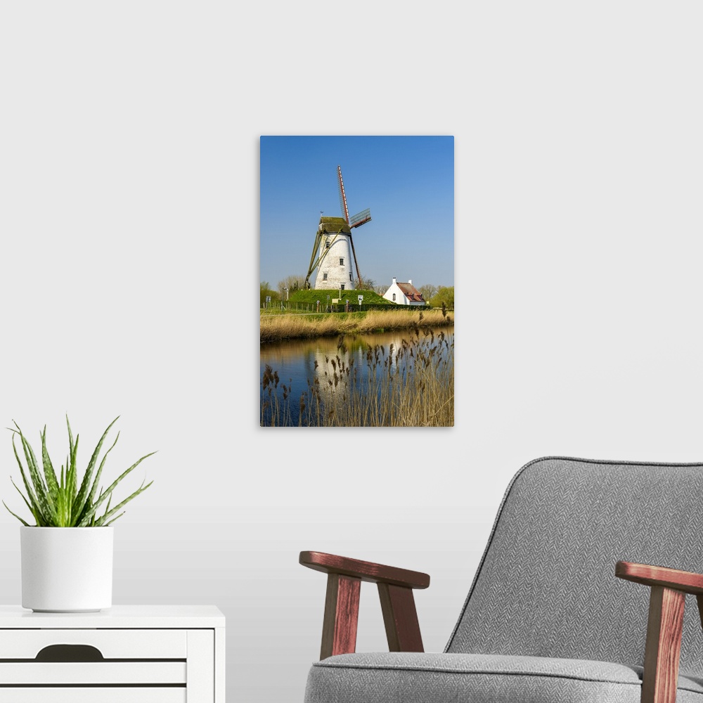 A modern room featuring Windmill along Damme canal, Damme, West Flanders, Belgium