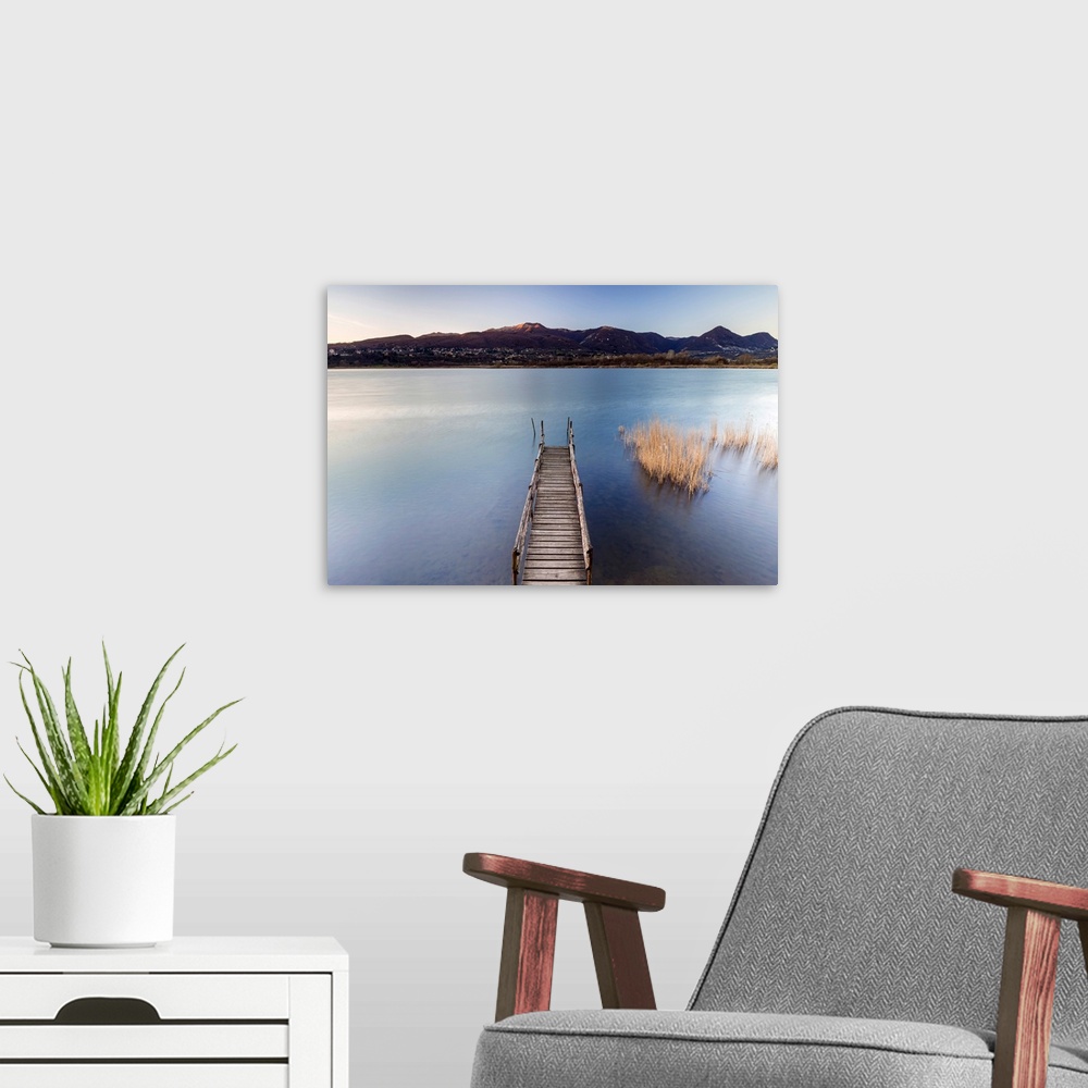A modern room featuring Windy sunset on Lago di Alserio, Monguzzo, Como district, Lombardy, Italy.