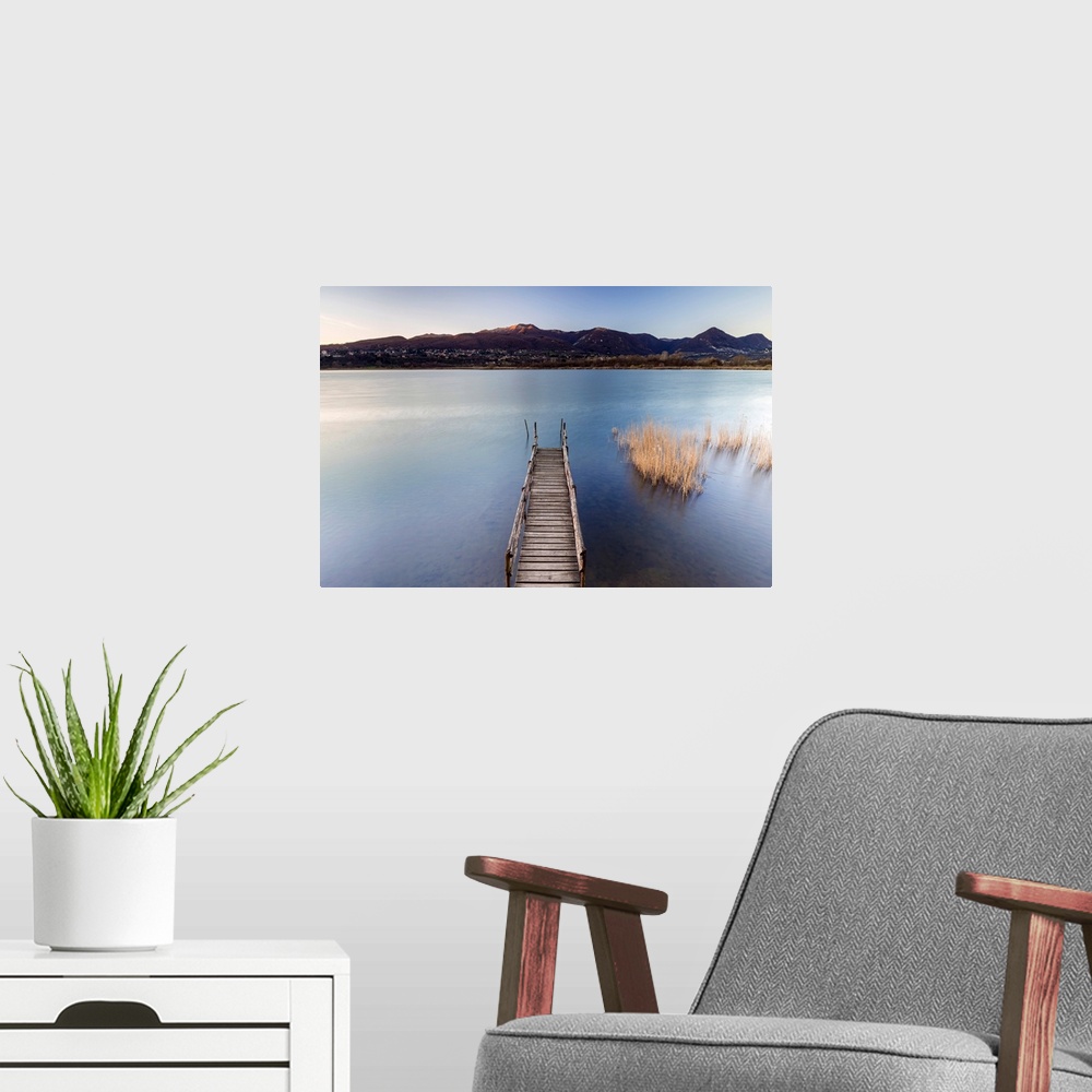 A modern room featuring Windy sunset on Lago di Alserio, Monguzzo, Como district, Lombardy, Italy.