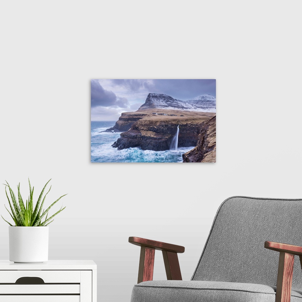 A modern room featuring Wintry conditions at Gasadalur on the island of Vagar, Faroe Islands, Denmark, Europe. Winter (Ma...