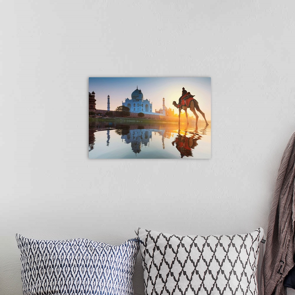 A bohemian room featuring India, Woman Crossing The Yamuna River On A Camel With The Taj Mahal In The Background At Sunset