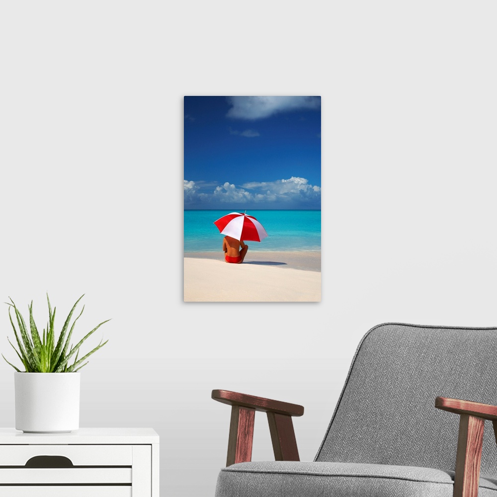 A modern room featuring Woman Sitting On Beach With Red And White Umbrella, Barbuda, Caribbean, West Indies