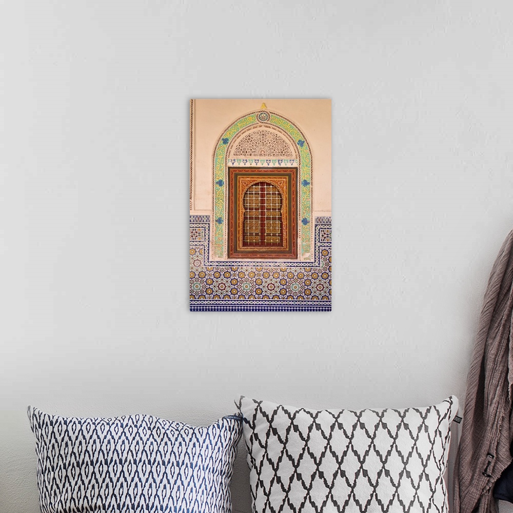 A bohemian room featuring Wood carving and stucco work in a window at the Zaouia Naciri in Tamegroute. Zagora region, Draa ...