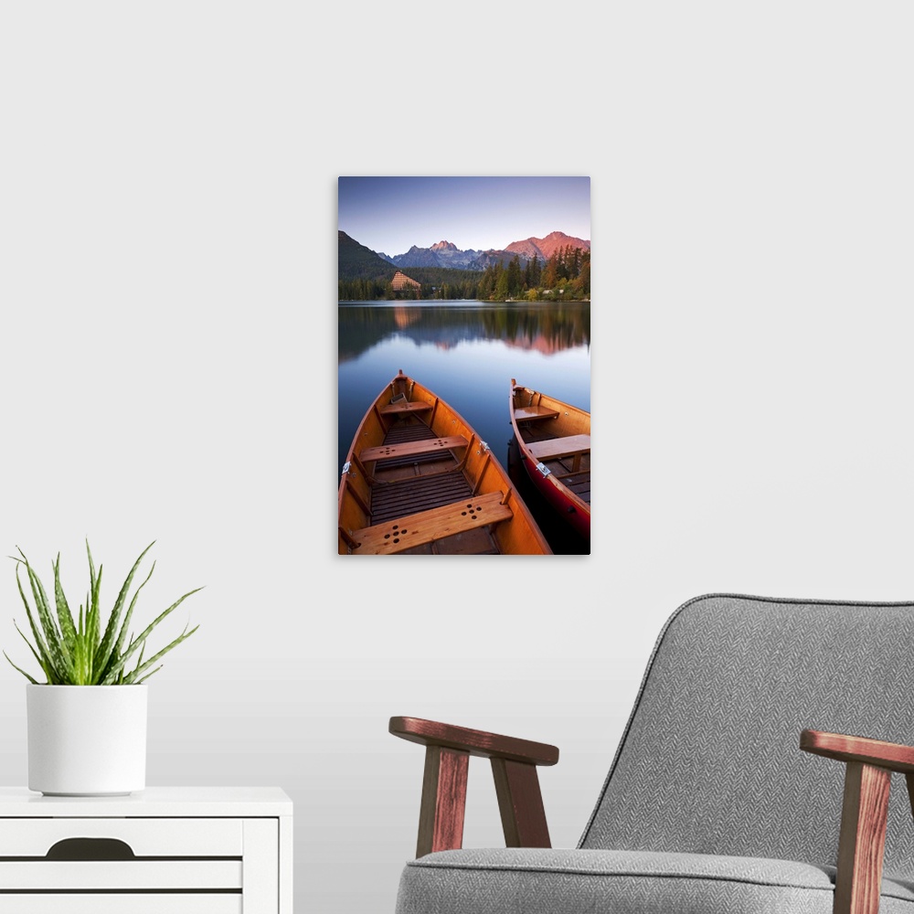 A modern room featuring Wooden boats on Strbske Pleso lake in the Tatra Mountains of Slovakia, Europe. Autumn