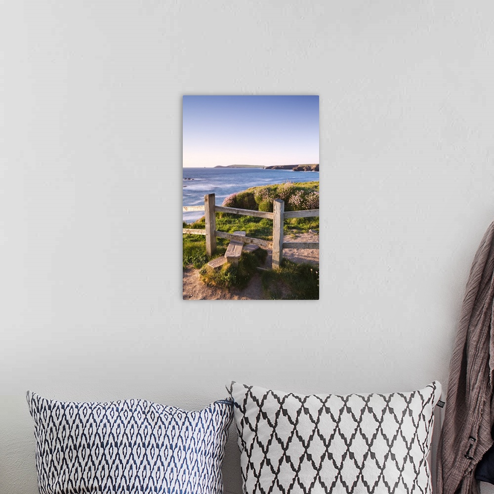 A bohemian room featuring Wooden stile on Cornish clifftops near Porthcothan Bay with views to Trevose Head, Cornwall, Engl...