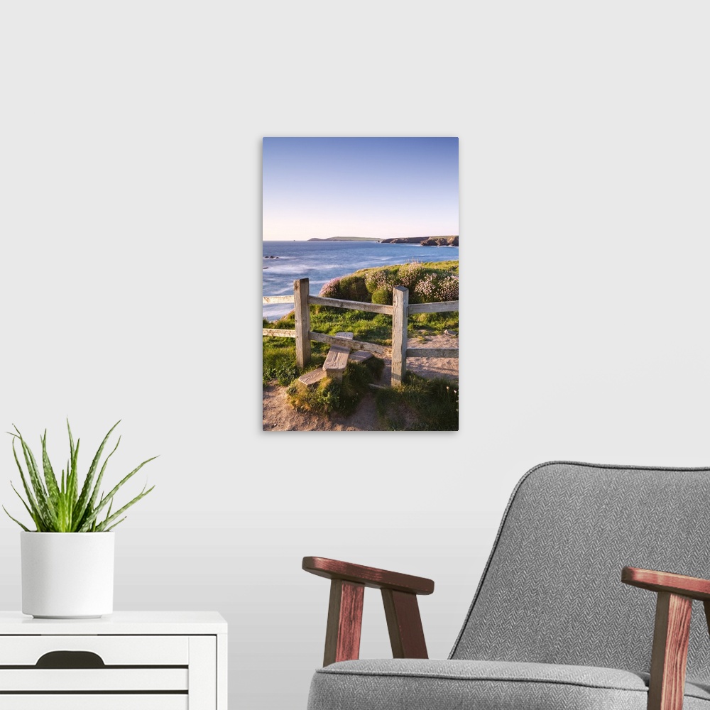 A modern room featuring Wooden stile on Cornish clifftops near Porthcothan Bay with views to Trevose Head, Cornwall, Engl...