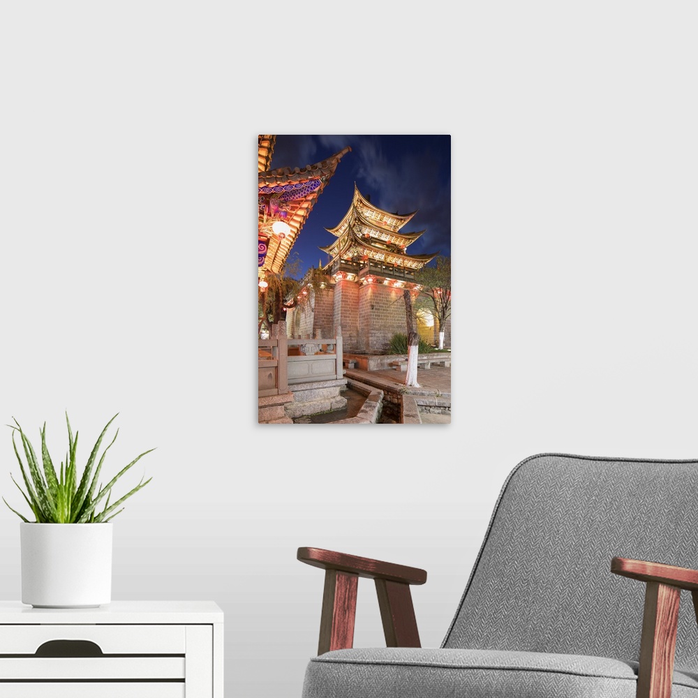 A modern room featuring Wu Hua Gate at dusk, Dali, Yunnan, China.