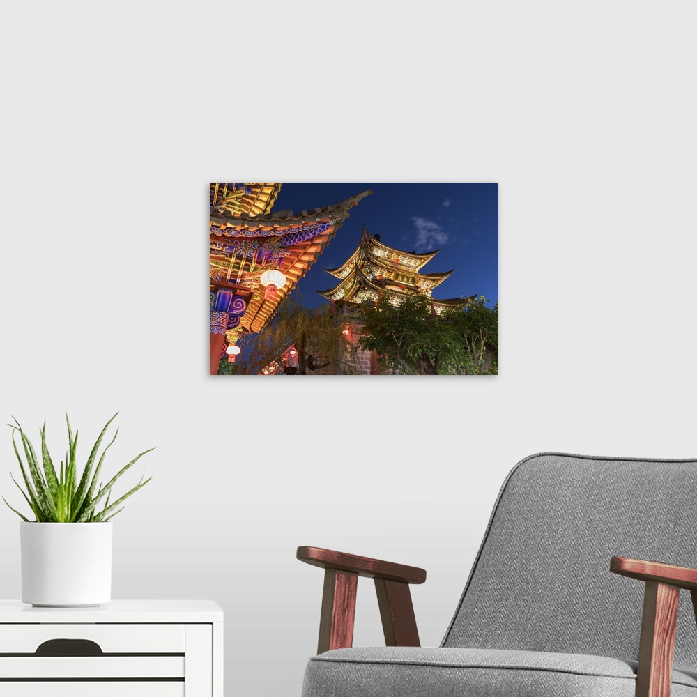 A modern room featuring Wu Hua Gate at dusk, Dali, Yunnan, China.
