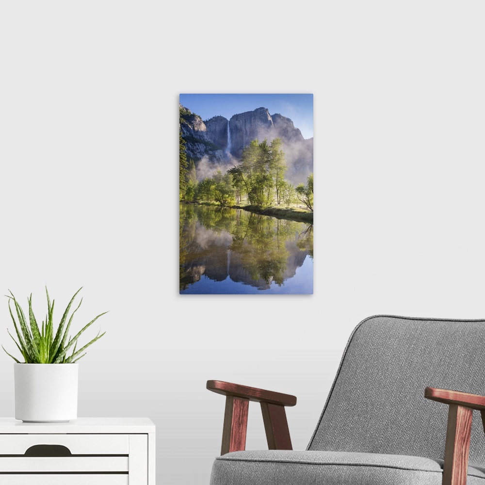 A modern room featuring Yosemite Falls reflected in the Merced River at dawn, Yosemite National Park, California, USA. Sp...