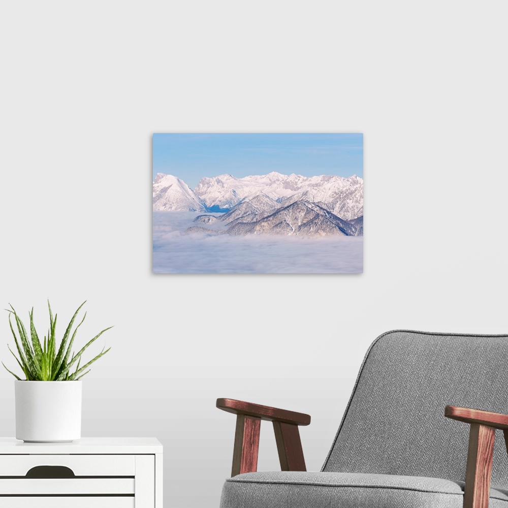 A modern room featuring The view over Zugspitze mountain on a foggy morning in the Inn valley, Patscherkofel mountain, In...