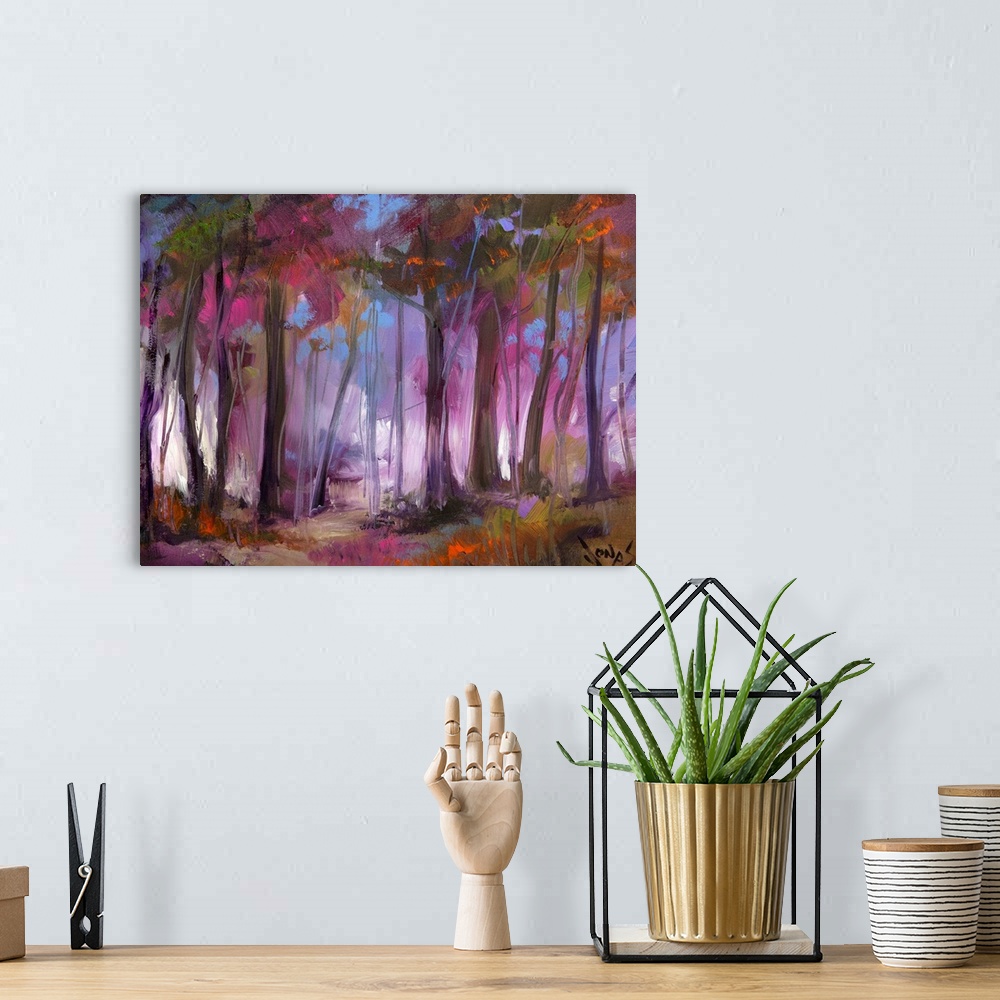 A bohemian room featuring A contemporary painting of a dark forest that has a purple hue over it.