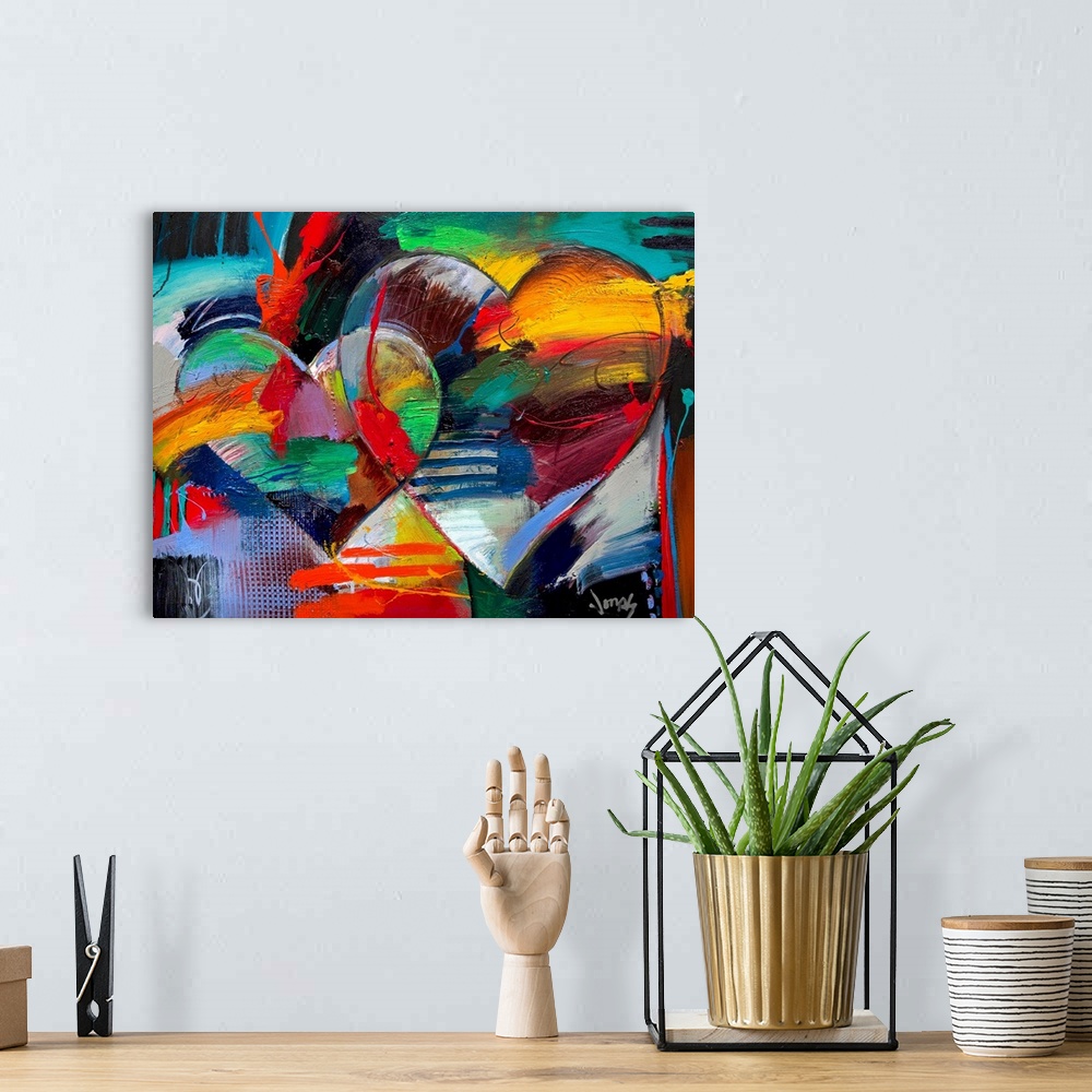 A bohemian room featuring Colorful abstract painting of two linking hearts.