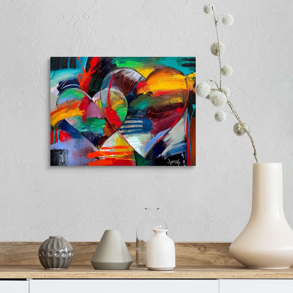 A farmhouse room featuring Colorful abstract painting of two linking hearts.