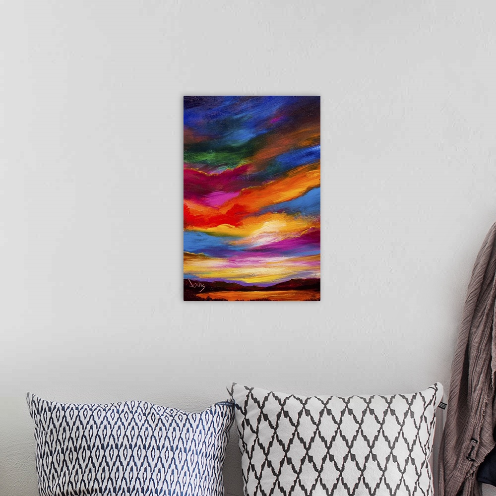 A bohemian room featuring A contemporary painting of a sunset sky ranging in a gamut of color.