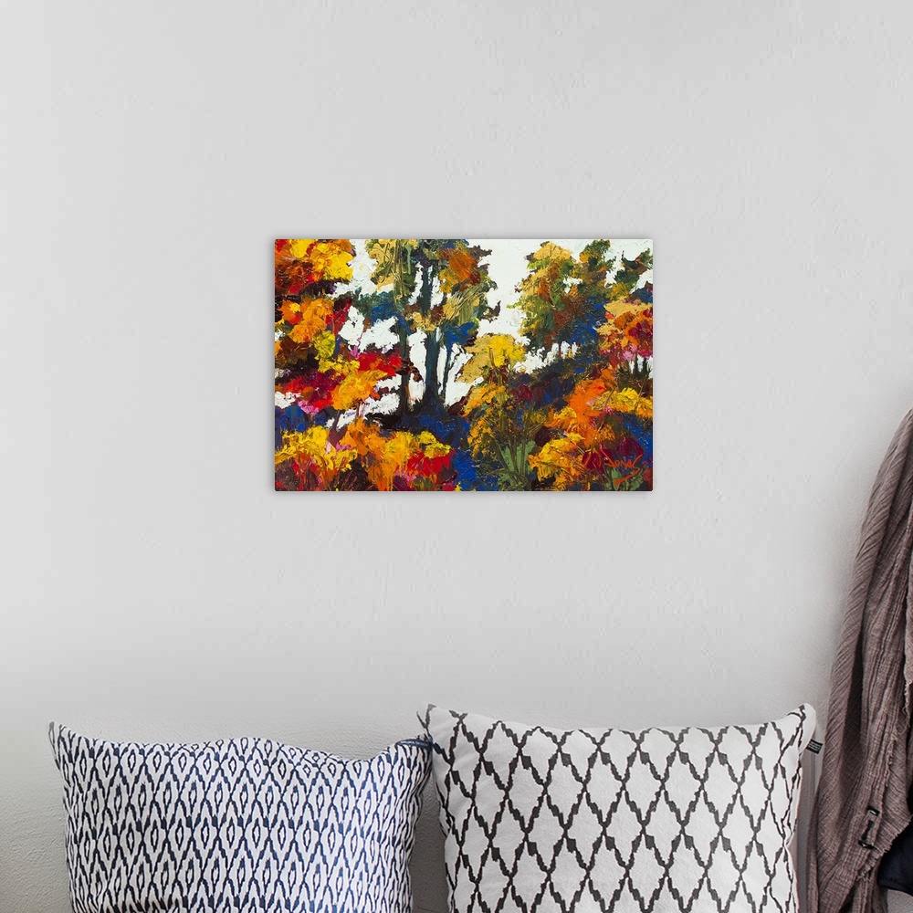 A bohemian room featuring Contemporary painting of a forest in autumn foliage.