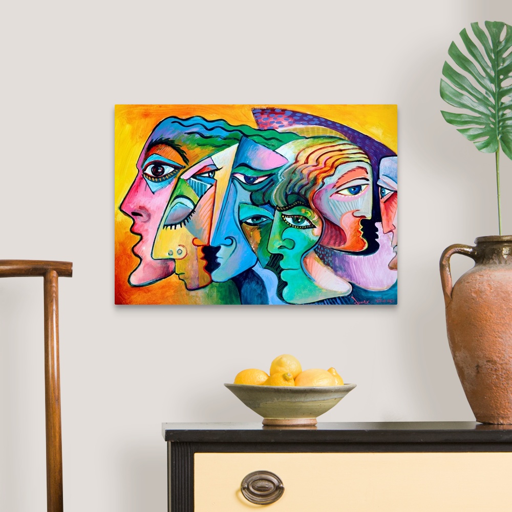 A traditional room featuring Contemporary painting of the profiles of several figurative inspired faces.
