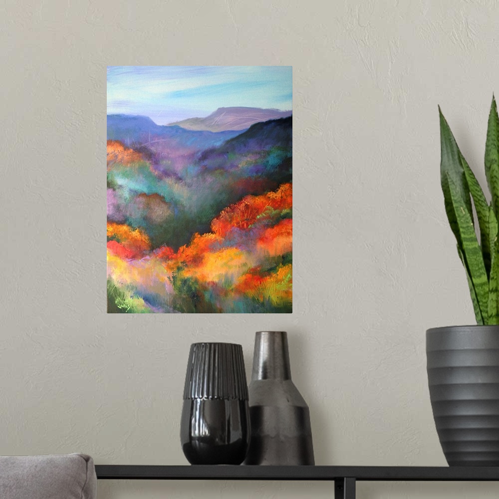 A modern room featuring Tall canvas painting of brightly colored trees with mountains in the distance.