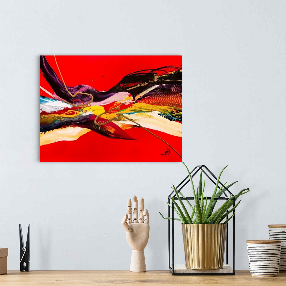 A bohemian room featuring A contemporary abstract painting of a fluid motion of color and texture against a red background.