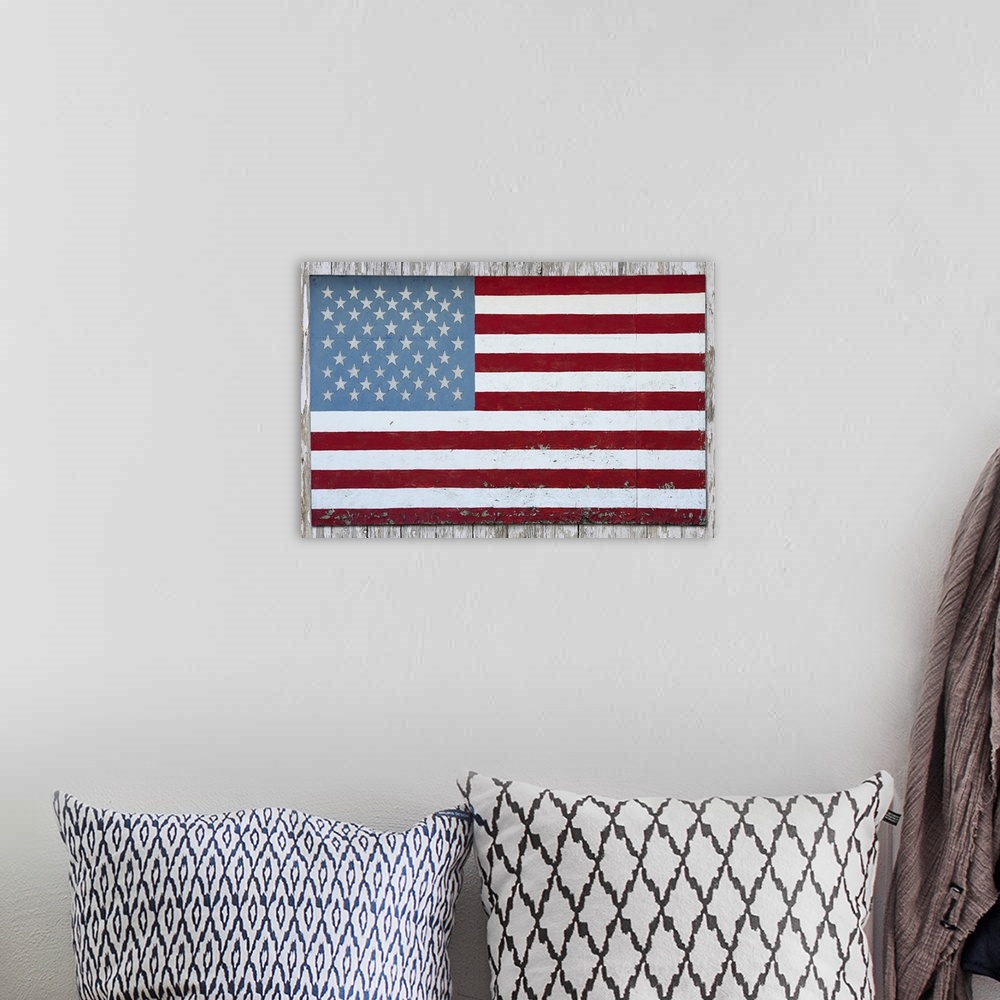 A bohemian room featuring American flag hanging on a barn in Michigan
