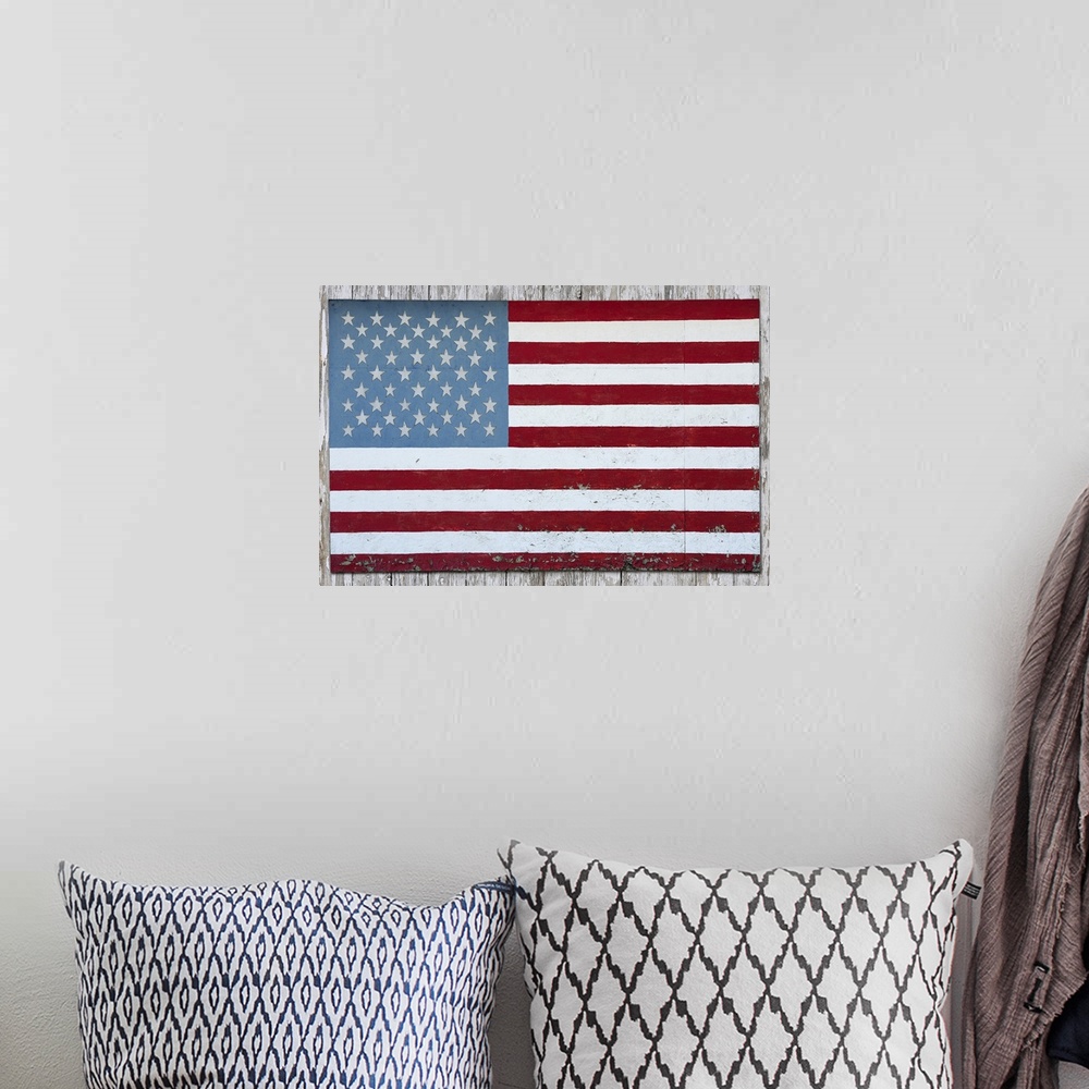 A bohemian room featuring American flag hanging on a barn in Michigan