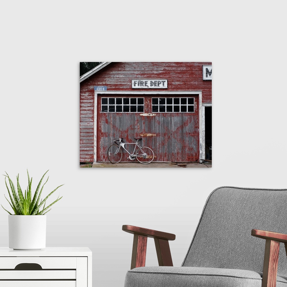 A modern room featuring Rustic fire dept. with a bicycle leaning against it in Michigan
