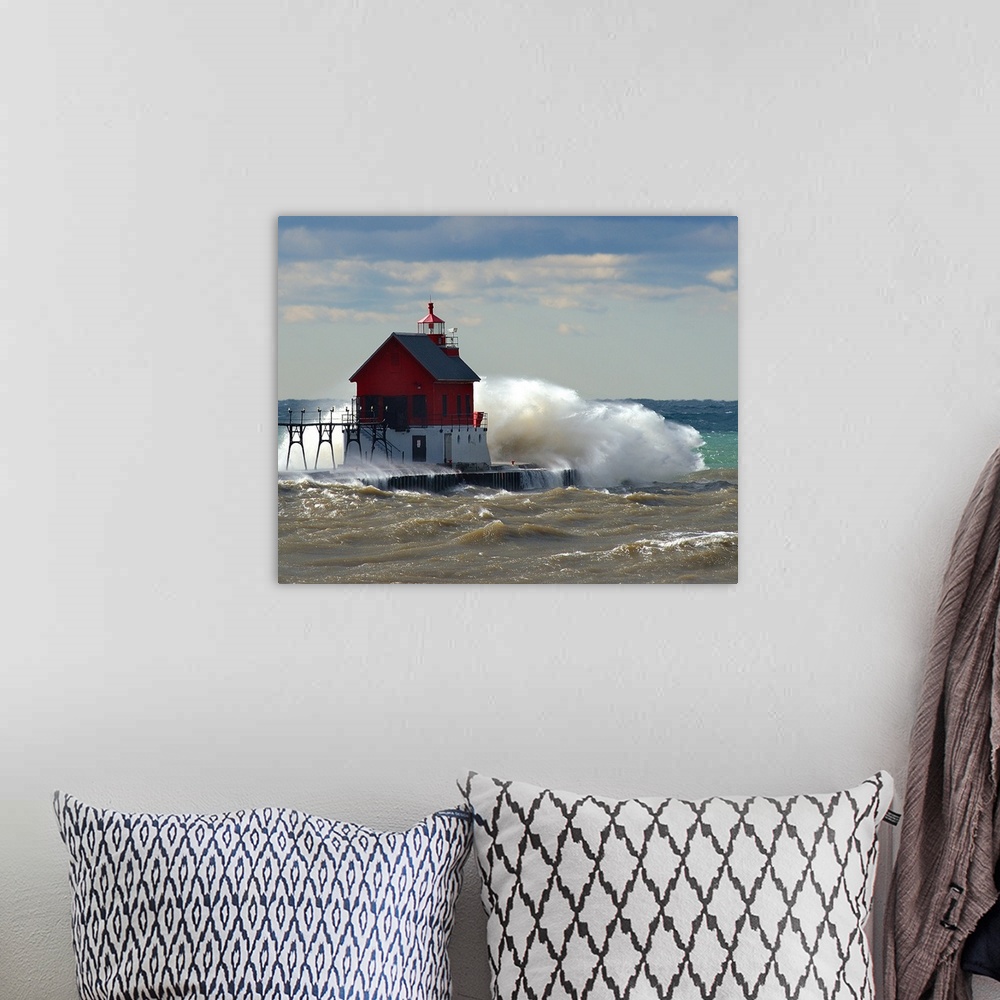 A bohemian room featuring Grand Haven Michigan Lighthouse with waves crashing