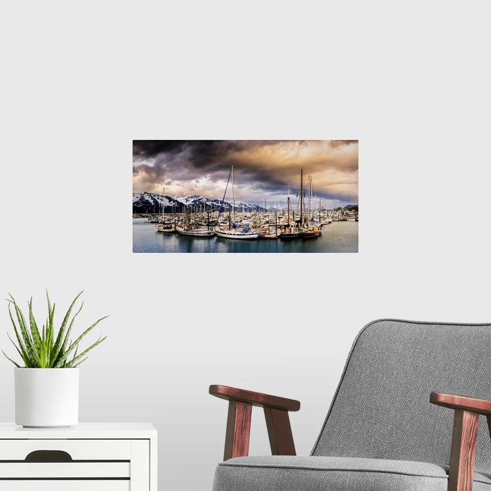 A modern room featuring Panoramic photograph of a huge group of sailboats sitting the middle of the water with snow cover...