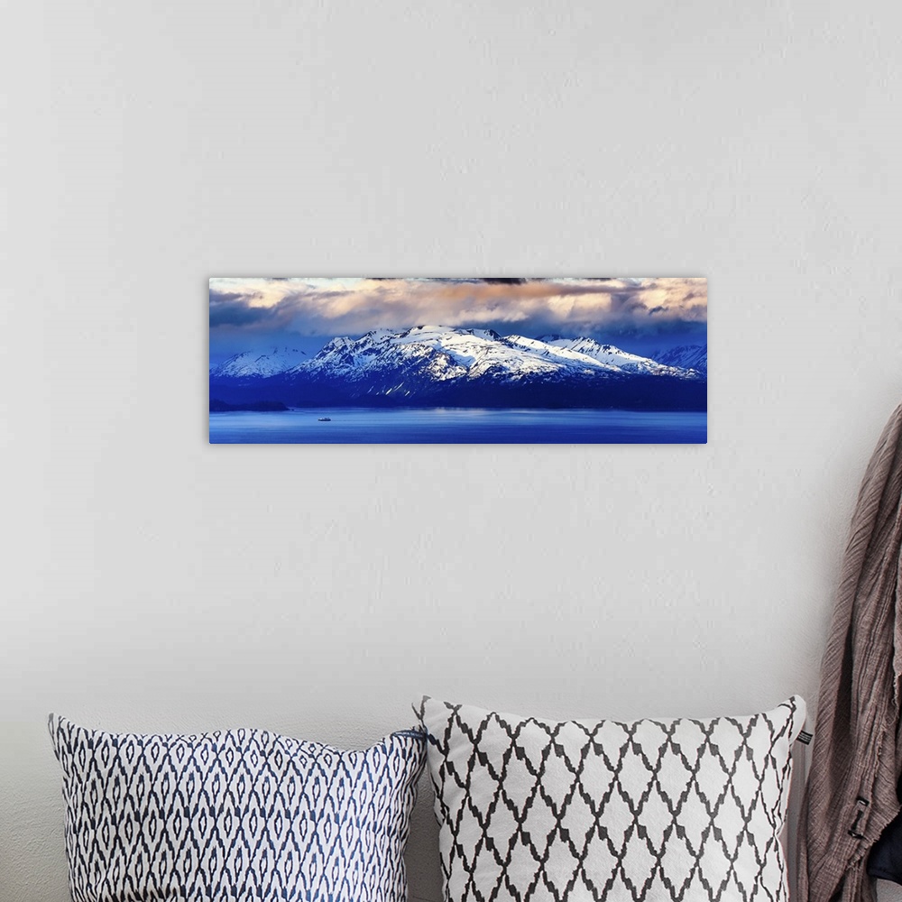 A bohemian room featuring A Panoramic of A Lone Fishing Boat Pulls Into Homer Bay at Sunrise; Homer, Alaska